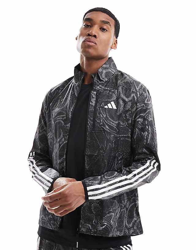 adidas Running Own the Run all over print jacket in black