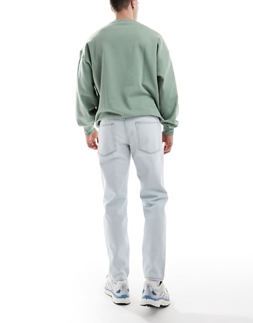 ASOS DESIGN Tapered Jeans In Bleach Wash Blue