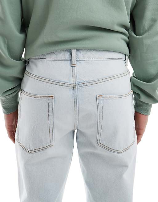 ASOS DESIGN Tapered Jeans In Bleach Wash Blue