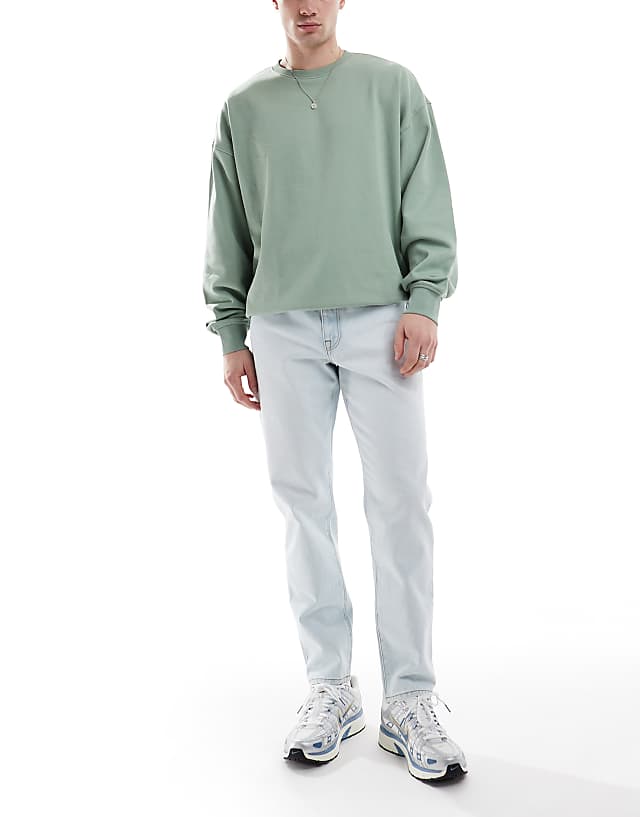 ASOS DESIGN tapered jeans in bleach wash blue