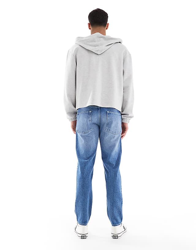 ASOS DESIGN Tapered Jeans In Light Wash Blue
