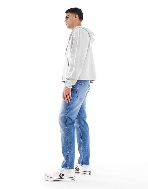 ASOS DESIGN Tapered Jeans In Light Wash Blue