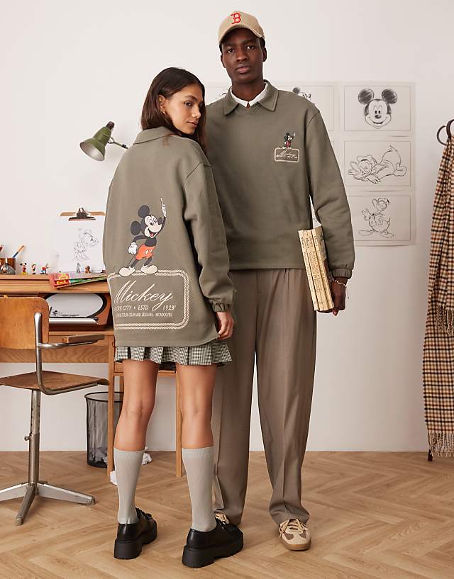 ASOS DESIGN Disney unisex oversized polo sweatshirt with Mickey Mouse prints in khaki