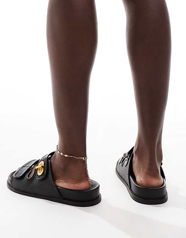 ASOS DESIGN Fawn Footbed Sliders With Twist Lock In Black