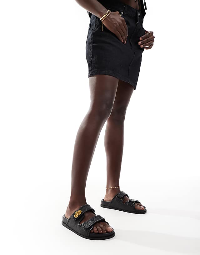 ASOS DESIGN Fawn Footbed Sliders With Twist Lock In Black