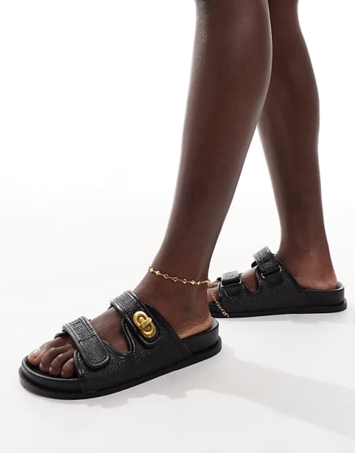ASOS DESIGN Fawn footbed sliders with twist lock in black