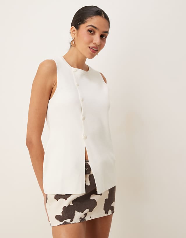 ASOS DESIGN knitted structured asymmetric button front waistcoat with split in cream