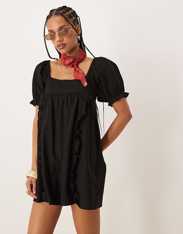 ASOS DESIGN linen babydoll puff sleeve playsuit with bow back detail in black