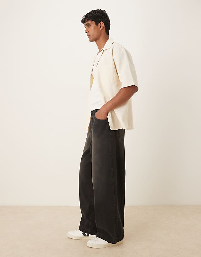 ASOS DESIGN Oversized Baggy Jeans In Black Wash With Brown Tint
