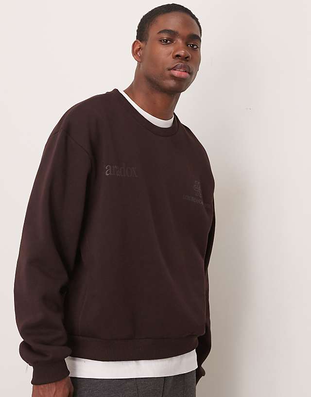 ASOS DESIGN oversized boxy sweatshirt with underarm panels and chest print in dark brown