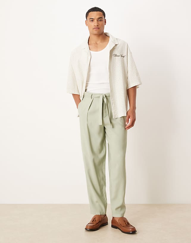 ASOS DESIGN oversized tapered smart trousers with belt detail in green
