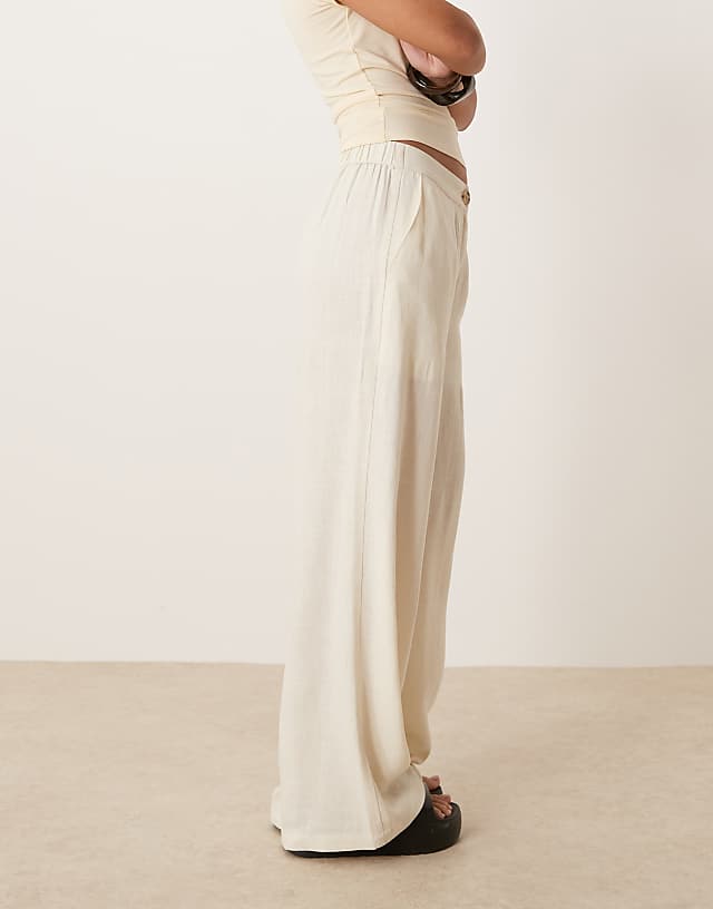 ASOS DESIGN Petite Relaxed Straight Leg Trousers With Linen In Off White