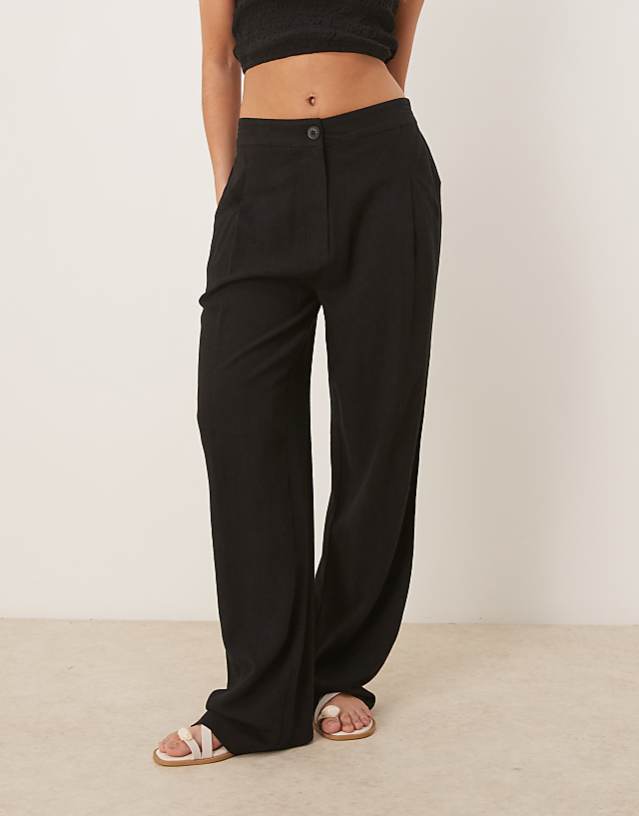 ASOS DESIGN pleat front tapered trousers with linen in black