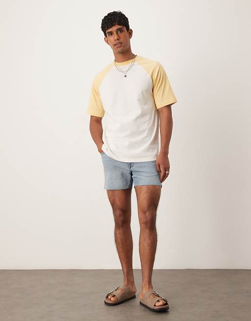 ASOS DESIGN shorter length slim denim shorts with rip detail in light wash blue