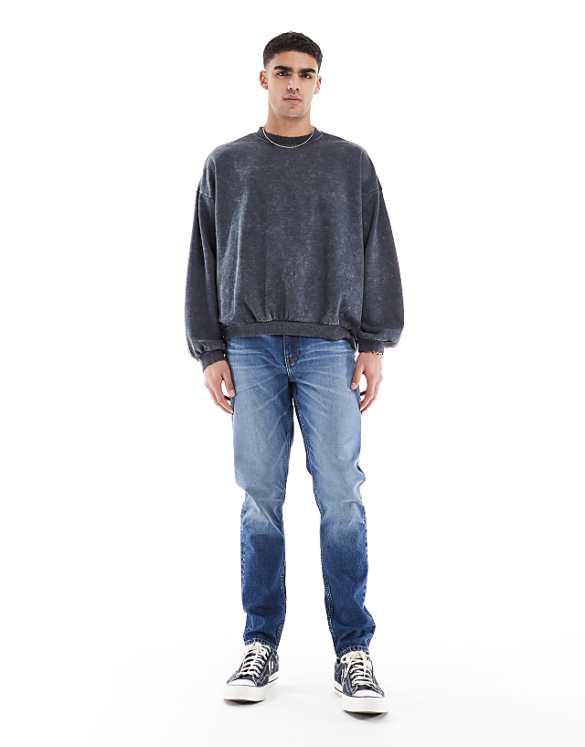 ASOS DESIGN skinny jeans with tint in mid wash blue