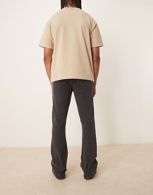 ASOS DESIGN Stretch Flared Jeans In Washed Black