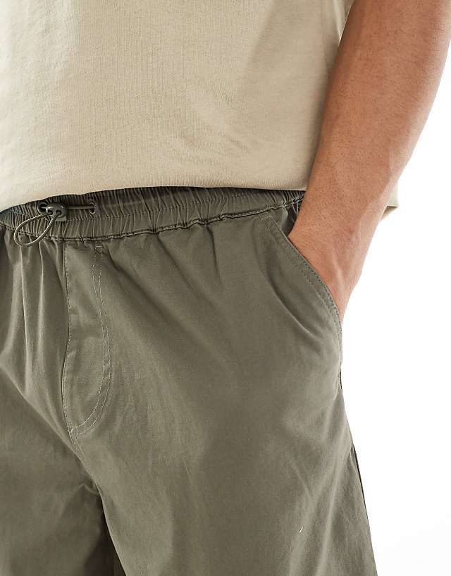ASOS DESIGN Super Baggy Cargo Trousers With Elasticated Waist In Washed Green