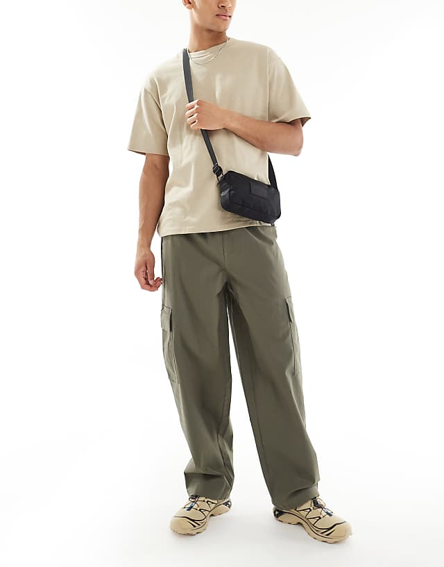 ASOS DESIGN super baggy cargo trousers with elasticated waist in washed green