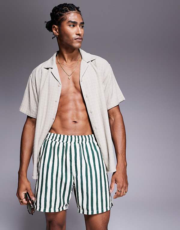ASOS DESIGN swim shorts in mid length in green stripe