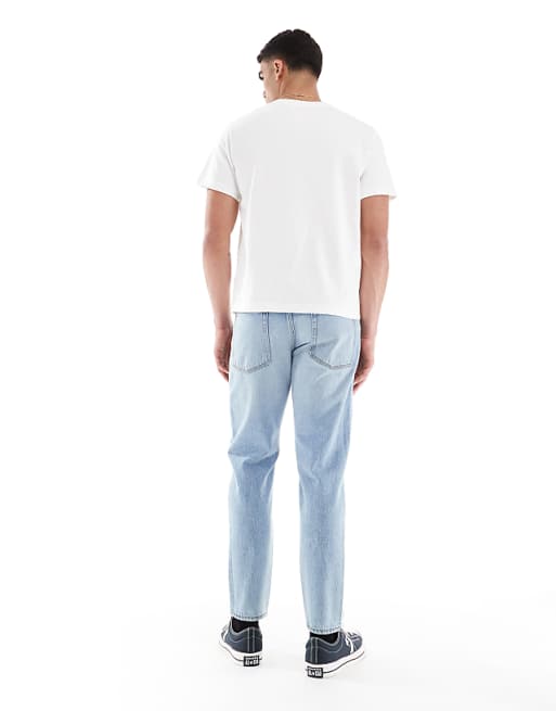 ASOS DESIGN Tapered Jeans In Vintage Light Blue Wash