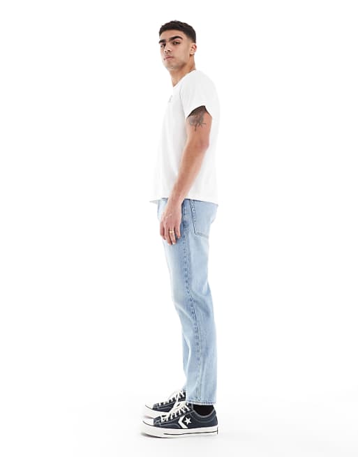 ASOS DESIGN Tapered Jeans In Vintage Light Blue Wash