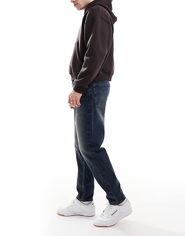 ASOS DESIGN Tapered Jeans With Vintage Tint In Dark Wash Blue