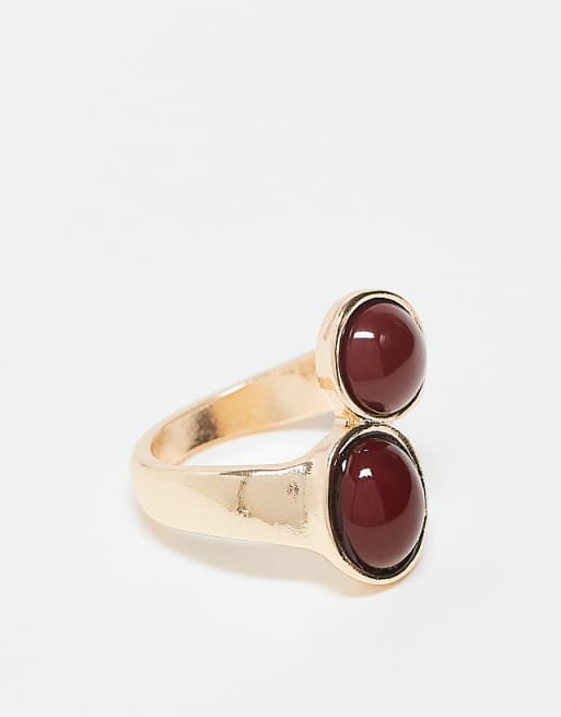 ASOS DESIGN wrap around ring with burgundy faux stones in gold tone