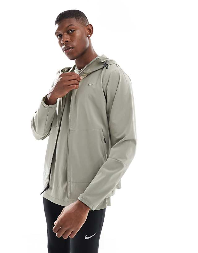 Nike Training Dri-FIT jacket in light khaki