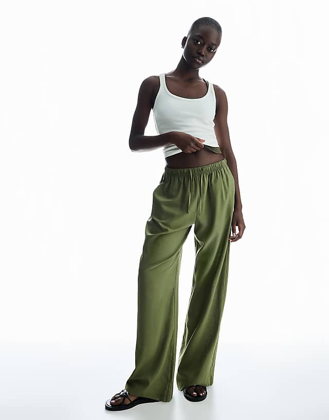 Bershka linen blend trousers with an elasticated waistband in khaki