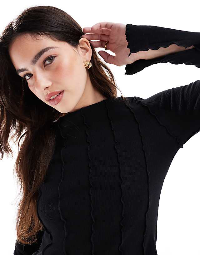 Monki Overlock Seam Detail Ribbed Jersey Top In Black