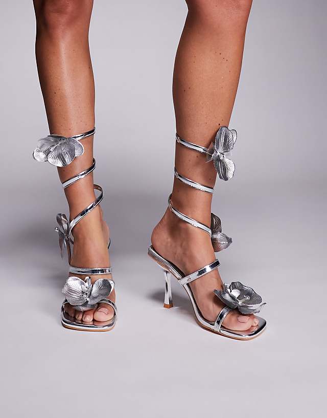 Public Desire Lotus Flower Trim Wrap Around Flared Stiletto High Heels in silver