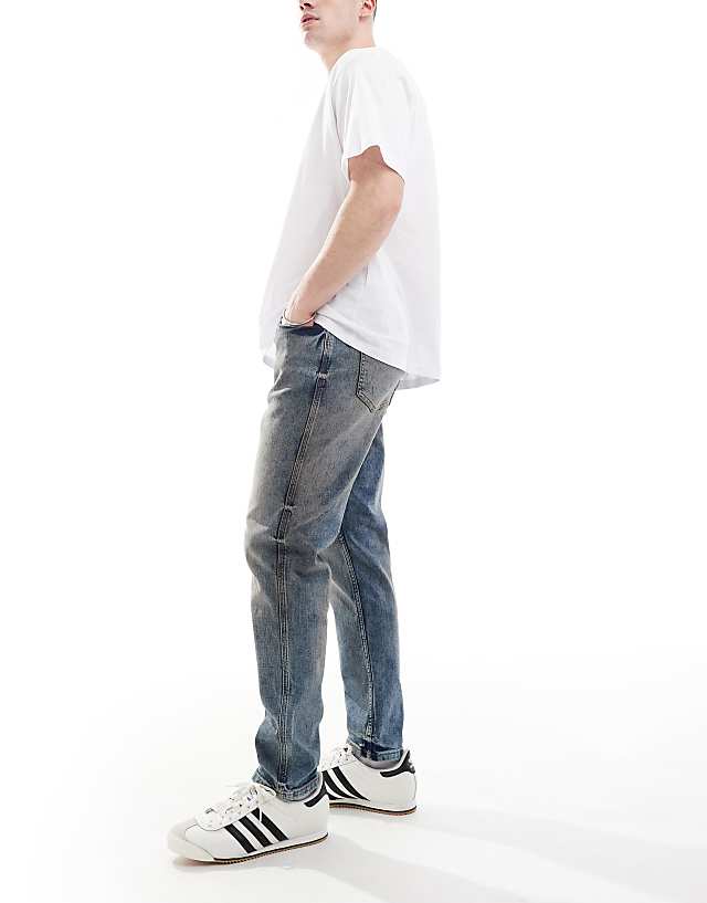 River Island Tapered Fit Jeans In Midwash Blue