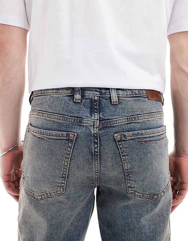 River Island Tapered Fit Jeans In Midwash Blue