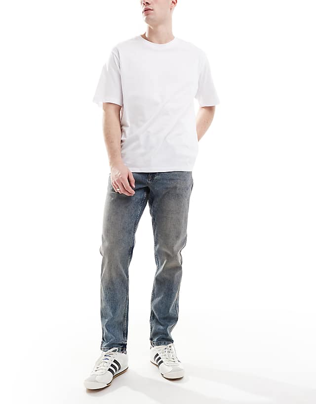 River Island tapered fit jeans in midwash blue