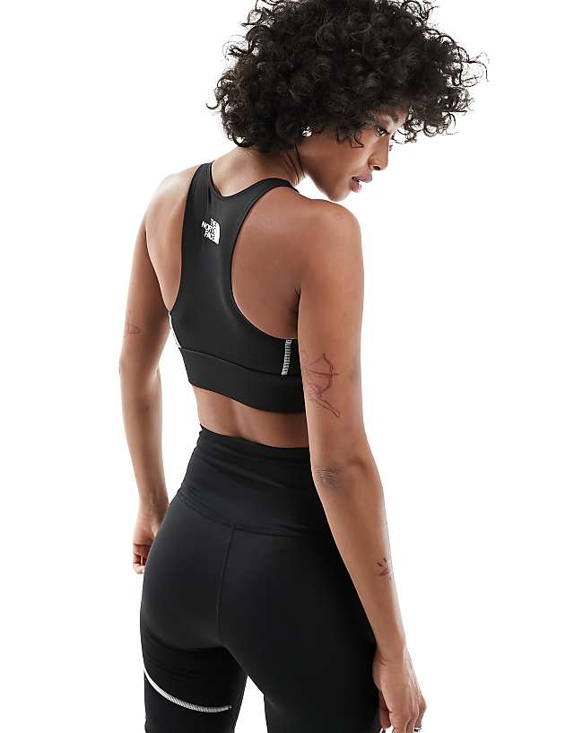 The North Face Training Hakuun Contour Seam Mid Support Sports Bra In Black